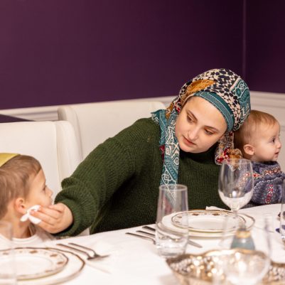 Mother wiping son's face