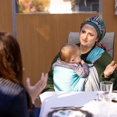Woman talking to friend in Sukkah 4
