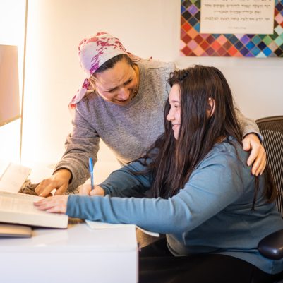 Mother helping teenage daughter with homework 3