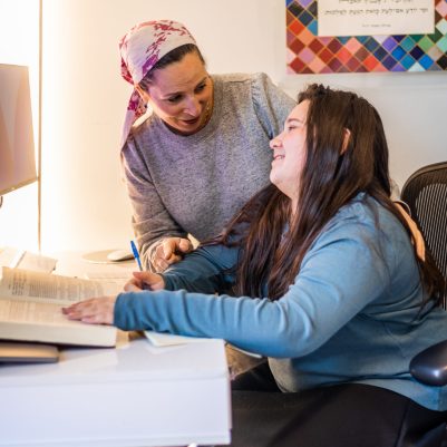 Mother helping teenage daughter with homework 4