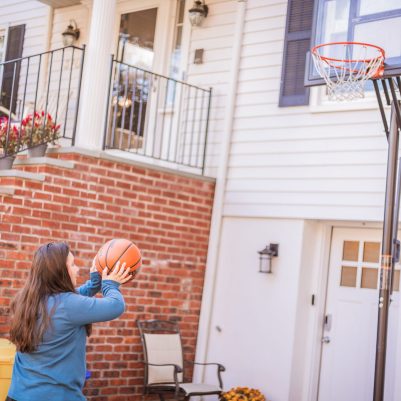 Young woman throwing basketball 2