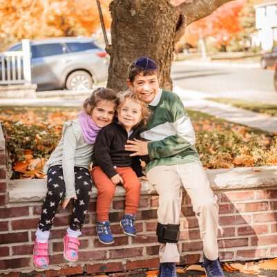 Siblings sitting outside 1