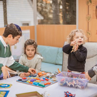Kids playing game in Sukkah 2