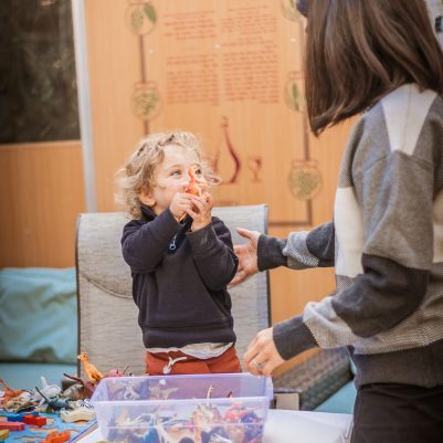 Mother and son playing game in Sukkah 1