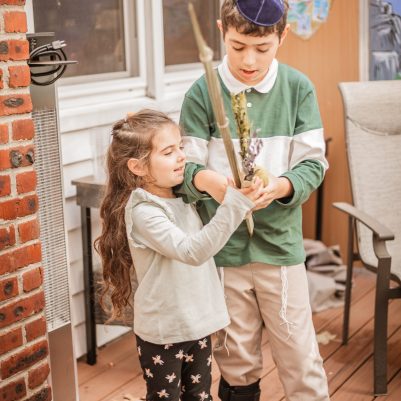 Brother and sister shaking Lulav 1