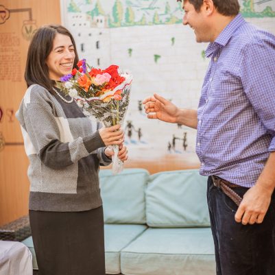 Husband giving flowers to wife 2