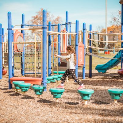Girl playing on jungle gym 1
