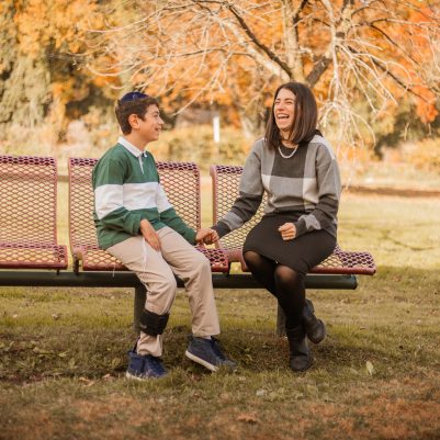 Mother and son talking on bench 3