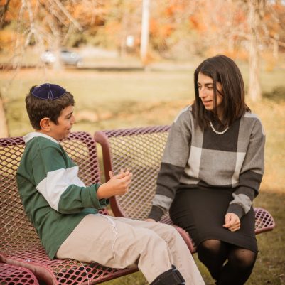 Mother and son talking on bench 4