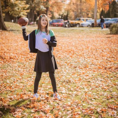 Girl playing football in park 1