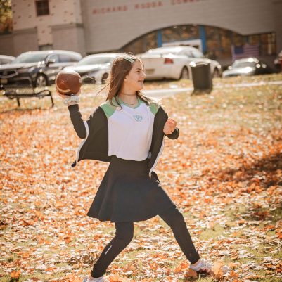 Girl playing football in park 3