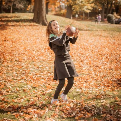 Girl playing football in park 4
