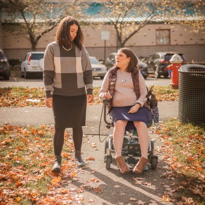 Woman in wheelchair at park with friend 1