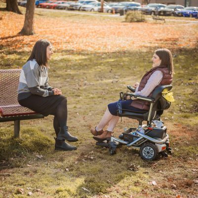 Two women talking in park 2