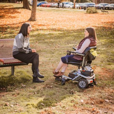 Two women talking in park 3