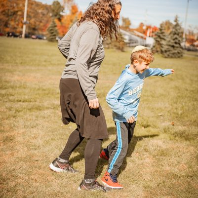 Family playing soccer 2