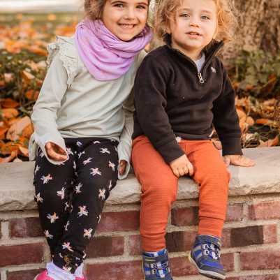 Smiling little kids sitting outside