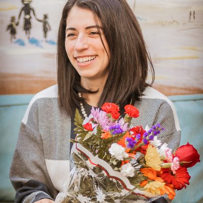 Woman holding bouquet of flowers
