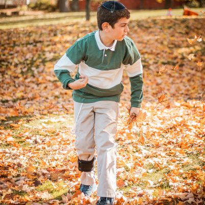 Boy running in park