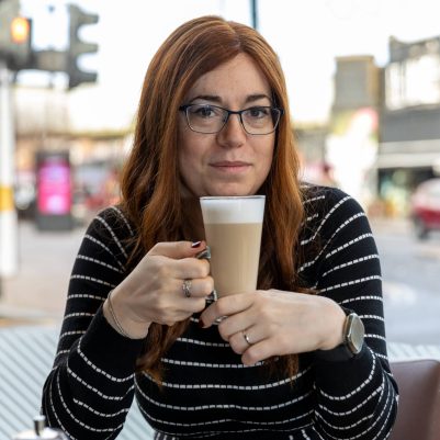 Woman drinking coffee at restaurant 2