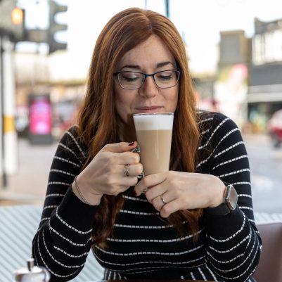 Woman drinking coffee at restaurant 3