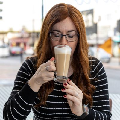 Woman drinking coffee at restaurant 4
