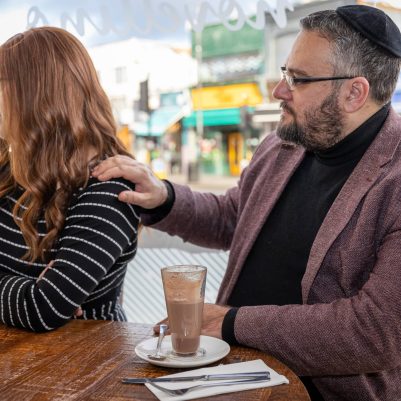 Man comforting wife at restaurant 1