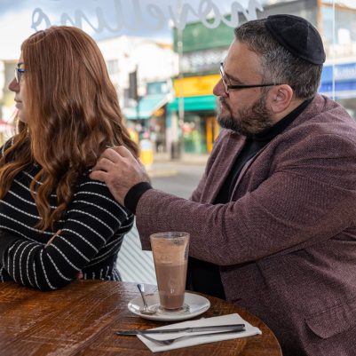 Man comforting wife at restaurant 2