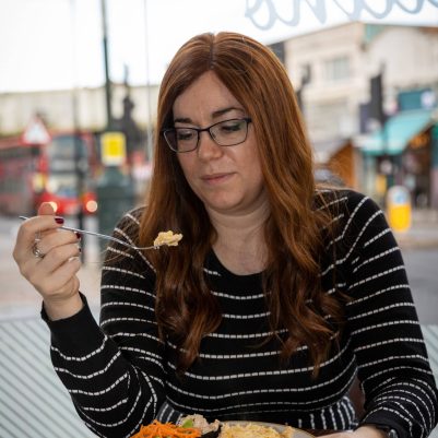 Woman eating at restaurant 1