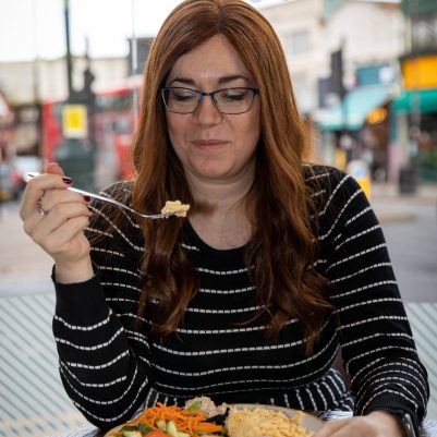 Woman eating at restaurant 2