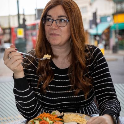 Woman eating at restaurant 3