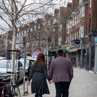 Couple walking on busy street 2