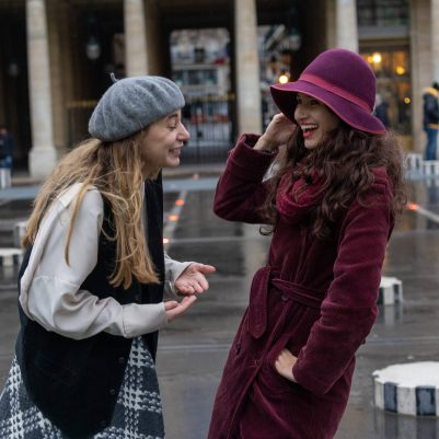Two women laughing outside