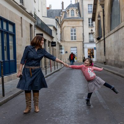 Mother and daughter holding hands
