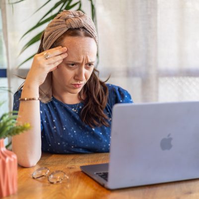 Woman looking at computer frustrated