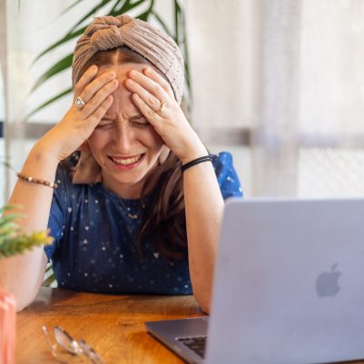 Woman crying next to computer 2