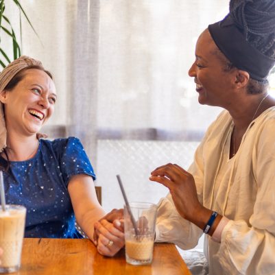 Two women talking in cafe