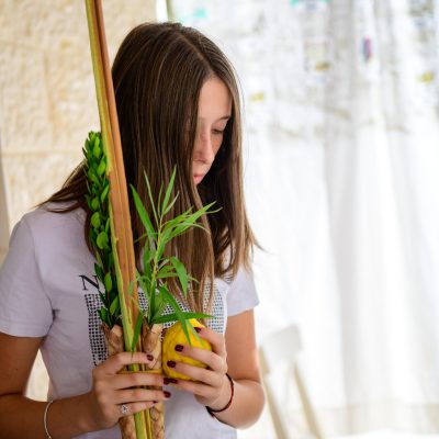 Teenager shaking lulav and etrog 3
