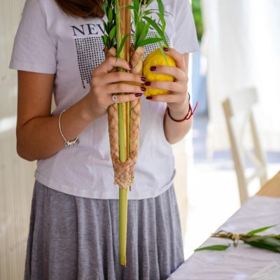 Teenager shaking lulav and etrog 4