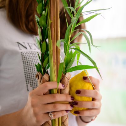 Teenager shaking lulav and etrog 6