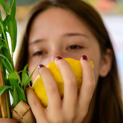 Teenager smelling Etrog 1
