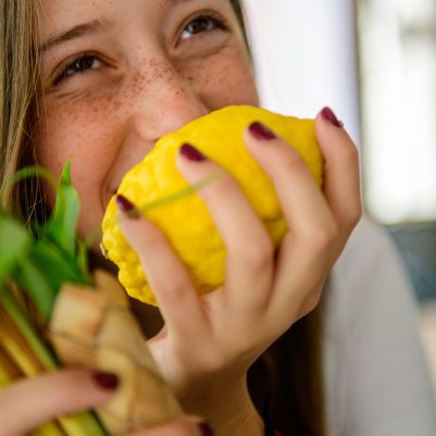 Teenager smelling Etrog 5