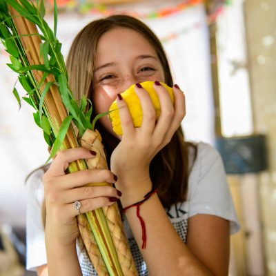 Teenager smelling Etrog 6