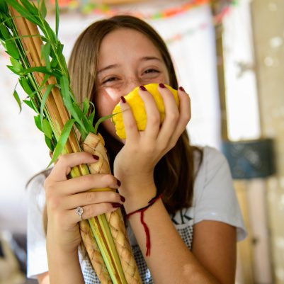 Teenager smelling Etrog 6