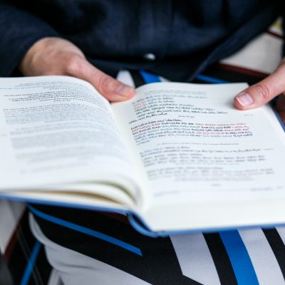Woman praying from siddur 2