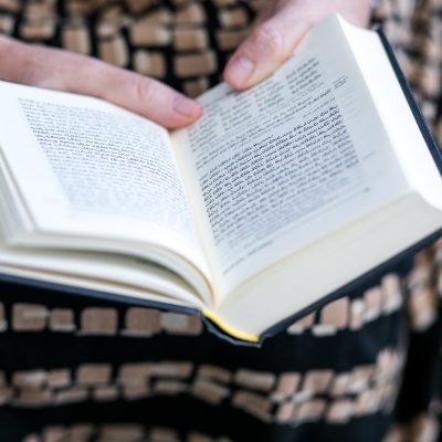 Woman praying from siddur 3