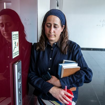 Sad woman waiting for elevator