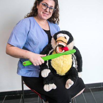 Dentist demonstrating toothbrush on stuffed animal 2