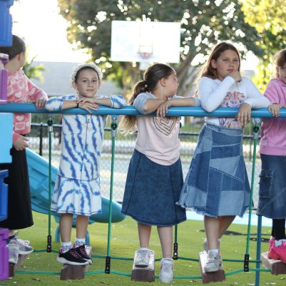 Children Standing in Line on Outdoor Playground for Play