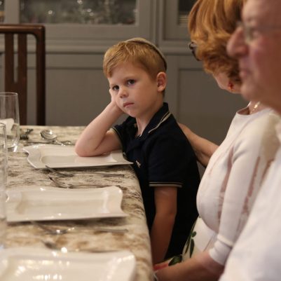Young Man Waiting for Dinner with His Grandparents at Home